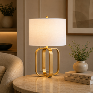 Lampe de table en métal Regal Orbit avec base en fer doré brossé, abat-jour en lin de qualité supérieure, éclairage ambiant chaleureux pour maisons de luxe - Product Image 1
