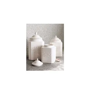 Set of four decorative metal kitchen canisters in varying sizes for stylish countertop food storage airtight lids - Product Image 5
