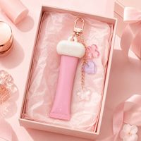 Porte-clés personnalisé avec crème pour les mains, capuchon en caoutchouc souple et breloques en acrylique pour cadeaux promotionnels d'entreprise