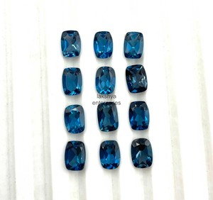 พลอยโทแพซสีน้ำเงินลอนดอนขนาด 7x9 มม. รูปทรงคุชชั่น แบบเจียระไนธรรมชาติ สำหรับทำเครื่องประดับ ราคาขายส่งจากอินเดีย - Product Image 6