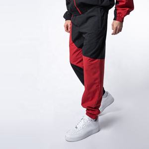 Venta al por mayor personalizado de los hombres de 2 piezas Jogger conjunto impermeable de secado rápido de poliéster bloque de color de nylon cortavientos chándal deportivo de invierno - Product Image 6
