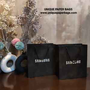 Sacs en papier blanchi de qualité supérieure en gros, sacs de shopping de luxe personnalisés avec logo imprimé pour l'emballage de détail - Product Image 1
