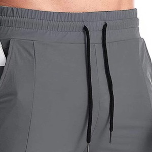 Shorts pour hommes en polyester à séchage rapide avec poches, taille à cordon de serrage, gris uni, shorts décontractés - Product Image 5