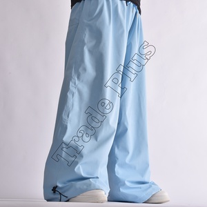 Pantalon de neige imperméable bleu clair de qualité supérieure avec taille à cordon de serrage, doublure chaude pour l'hiver, ourlet réglable et design ample - Product Image 3