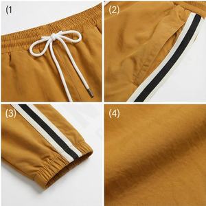 Pantalon de survêtement en nylon à jambe large et ouverture zippée sur le côté personnalisé Patchwork ceinture élastique pantalon empilé pour hommes pantalon d'hiver de survêtement pour hommes - Product Image 4