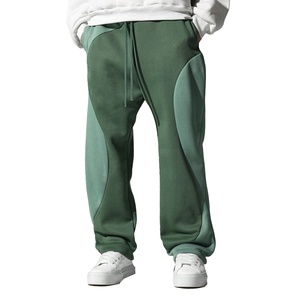 Pantalones de chándal de forro polar para hombre, casuales, de pierna ancha, holgados, transpirables, con cintura elástica, bloques de color, patchwork irregular, talla grande, para invierno y descanso - Product Image 1