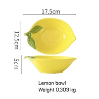 Service de vaisselle créatif en céramique jaune en forme de citron, comprenant un saladier, un bol à dessert et une assiette à fruits.