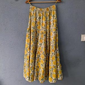 Elevate everyday ethnic wardrobe with this charming yellow floral tiered long <b>skirt</b> Crafted from soft breathable fabric - Product Image 1
