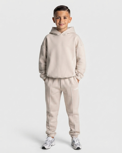 Conjunto Deportivo para Niños, Sudadera con Capucha Extra Grande y Pantalones Deportivos en Color Crema con Líneas en Contraste, Traje de Algodón Suave para Niños, Fabricante OEM ODM - Product Image 1