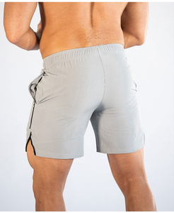 Shorts de sport pour hommes en polyester et élasthanne, bleu marine uni, taille mi-haute, élastique, séchage rapide, avec bande latérale tricotée - Product Image 5