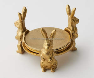 Vente en gros de 4 sous-verres de haute qualité en forme de lapin faits à la main en métal doré avec support dessus de table sous-verres décoratifs à sublimation - Product Image 1