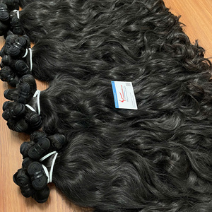 Cabello humano vietnamita virgen en trama, color natural, ondulado, sin caída ni enredos, producto estrella. - Product Image 4