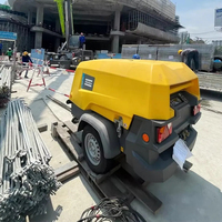 Compresseur d'air à vis diesel portable Atlas Copco XAS98KD 7 bars 190 CFM, alimenté par un moteur Kubota, pour usage en construction