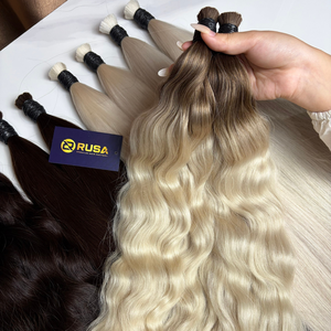 Venta al por mayor de fábrica de cabello vietnamita a granel de alta calidad, extensiones de cabello ondulado personalizadas, sin sintéticos, con longitud de 10 a 34 pulgadas. - Product Image 1