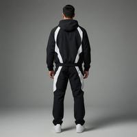 Ensemble de survêtement coupe-vent en nylon enduit personnalisé avec col montant et poignets élastiques, et ensemble de tenue de pluie avec passepoil personnalisé pour les programmes d'équipe