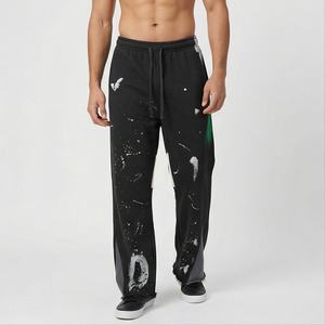 Pantalones acampanados de salpicaduras de pintura a la moda, pantalones de chándal para correr con borde crudo con estampado de letras personalizado, pantalones de chándal acampanados elásticos con grafiti de retazos - Product Image 1