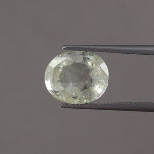 พลอยแซฟไฟร์สีเหลืองธรรมชาติ 100% รูปทรงวงรี ขนาด 10.5x9 มม. น้ำหนัก 4.65 กะรัต ผ่านการรับรองจาก IGI  แบบเคลือบแว็กซ์/น้ำมัน  แสดงสีสันสวยงาม - Product Image 1