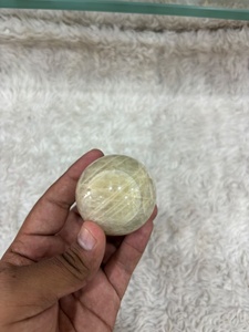 Cream moonstone <b>sphere</b> with soft ivory coloring subtle sheen rounded contours smooth polishing and refined mineral appeal - Product Image 3