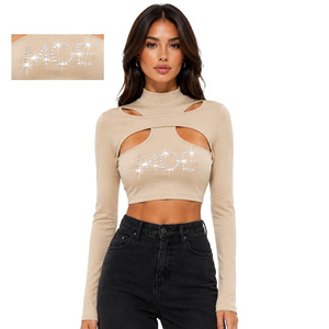 Blusa Corta de Manga Larga con Cuello Alto y Recortes en Color Beige para Mujer, con Logotipo Personalizado en Pedrería, 100% Algodón, Estilo Casual - Product Image 1