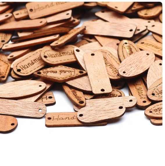 Set of 50 wooden card shapes with simple engravings in a variety of