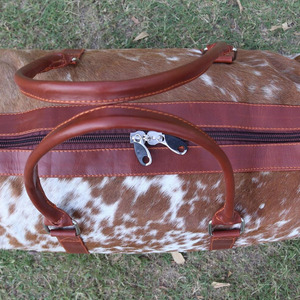 Premium cowhide leather hair on travel <b>bags</b> wholesale supplier OEM custom logo handmade export fashion luggage <b>bags</b> for sale - Product Image 2