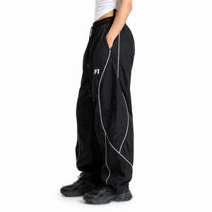 Pantalones de hombre a la moda, de alta calidad, con ribetes personalizados, logotipo bordado, holgados, impermeables, cortavientos, de poliéster, estilo baggy, de nailon, para deporte. - Product Image 4