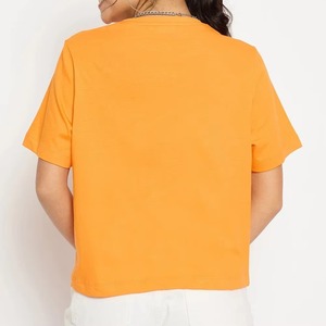 เสื้อยืดพิมพ์ลายโพลีเอสเตอร์คุณภาพส่งออก OEM ODM สำหรับผู้หญิง ปักลาย ขายส่ง เสื้อยืดโอเวอร์ไซส์สีส้มตามสั่ง - Product Image 3