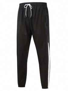 Ensemble survêtement 2 pièces pour homme, veste à capuche zippée et pantalon coupe-vent, motif chevron color block blanc et noir - Product Image 2