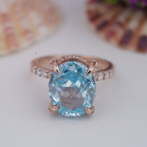 Luxury Women's Rose Gold Plated 925 Sterling Silver Oval Cut 6*8mm 5A Light Blue Moissanite Engagement Ring - Product Image 1