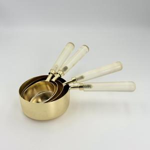 Juego de Tazas y Cucharas Medidoras de Acero Inoxidable con Revestimiento PVD Dorado y Mango de Resina Transparente de Cuatro Piezas, Herramientas Cuantitativas para Hornear y Cocinar - Product Image 1