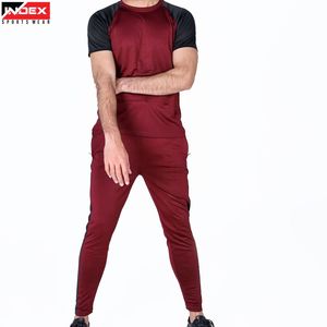 ชุดกีฬาผู้ชายฤดูร้อนแบบ OEM ผลิตในสหรัฐอเมริกา เสื้อยืด กางเกงขายาว ชุดออกกำลังกาย ระบายอากาศได้ดี เหมาะสำหรับฟิตเนส วิ่ง และเล่นกีฬา - Product Image 1