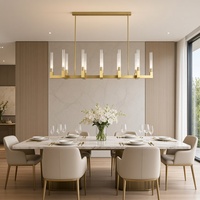 Lustre linéaire LED de luxe en métal et verre transparent avec hauteur réglable et longueur personnalisable pour projets hôteliers et de villas