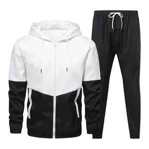 Ensemble de survêtement unisexe à capuche bicolore 2-en-1 avec pantalon de jogging à taille élastique et poches latérales en polyester mi-lourd - Product Image 1