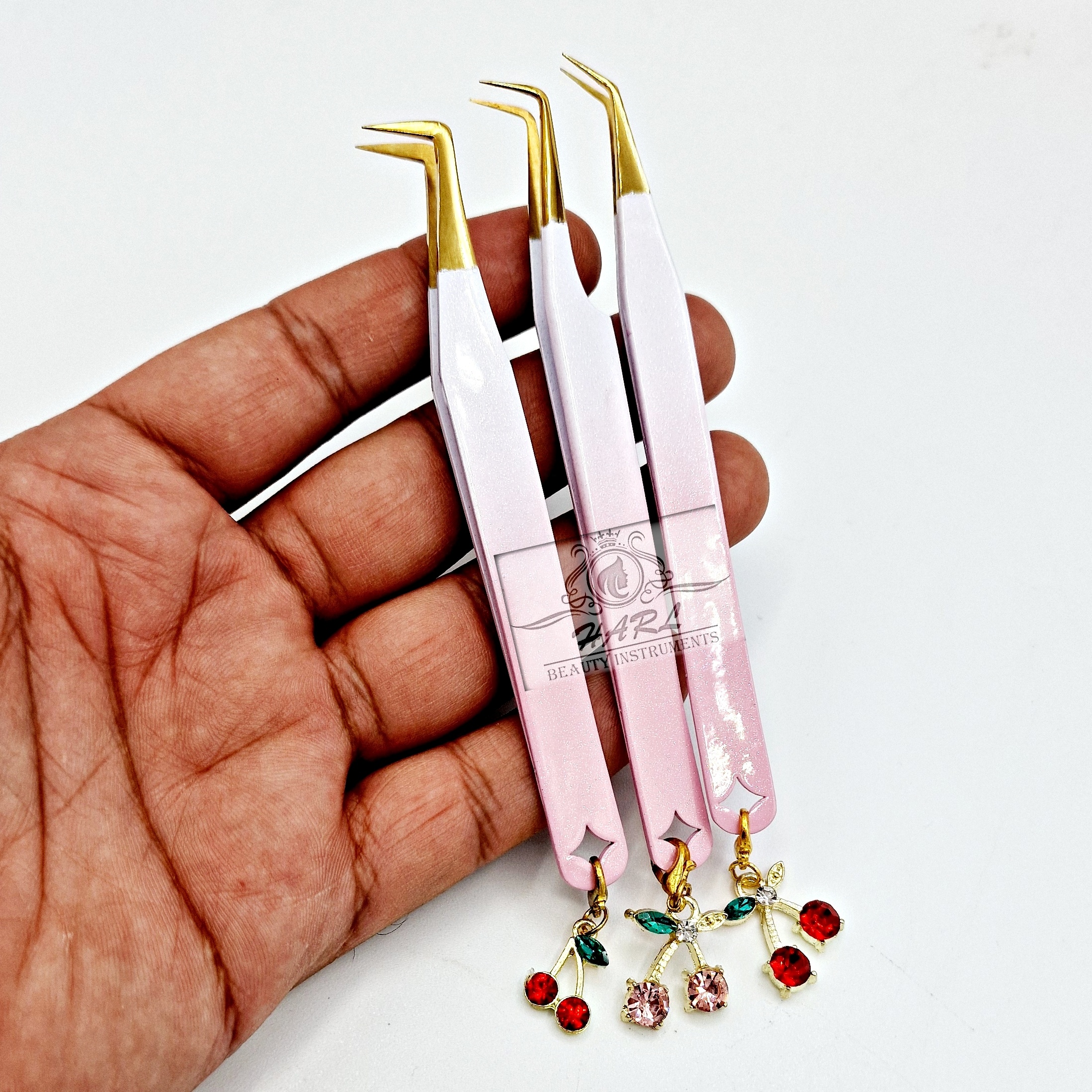 Pinces à épiler avec breloques motif cerise