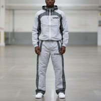 Ensemble de survêtement coupe-vent en coton pour homme, grande taille, avec logo personnalisé OEM, veste de sport unie à fermeture éclair pour le jogging, style streetwear hiver
