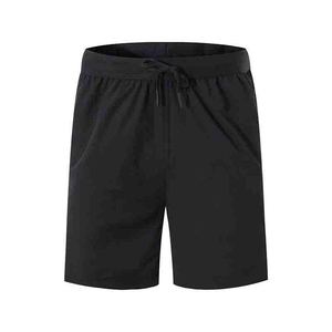 Pantaloncini da uomo leggeri per palestra e corsa, con logo frontale, ad asciugatura rapida, traspiranti, in Spandex/Poliestere, con coulisse in vita e tasca con cerniera - Product Image 5