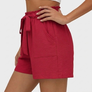 Pantalones cortos informales para mujer, cintura alta, cintura elástica con cordón y bolsillos, ajuste holgado, color sólido - Product Image 1