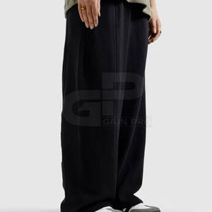 Pantalones deportivos anchos para hombre, de tela elástica cómoda, ideales para entrenamientos en el gimnasio, correr y uso diario. - Product Image 4