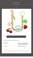 Pendentif de sac en alliage de zinc, motif cerise, papillon, trèfle, cœur, bicolore or et argent, ornement de sac fleur, porte-clés tendance