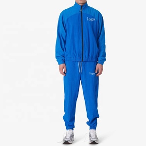 Conjunto Deportivo para Hombre, Chaqueta Cortavientos Azul con Cierre Completo y Pantalones Jogger, Ropa Deportiva Transpirable de Punto, Estilo Urbano - Product Image 1