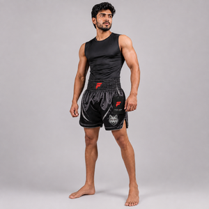 Pantalones cortos de Muay Thai de primera calidad diseñados con tela ligera, transpirable y cómoda, y movimiento sin restricciones para cada sesión de entrenamiento. - Product Image 1