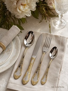 Luxury <b>silver</b> stainless steel flatware set featuring embossed <b>ornate</b> scroll handles and <b>mirror</b> polished heads displayed - Product Image 5