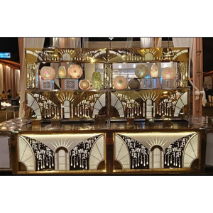Mostrador de exhibición para catering de acero inoxidable diseñado para presentaciones tipo buffet con acabado dorado pulido y patrones decorativos - Product Image 1
