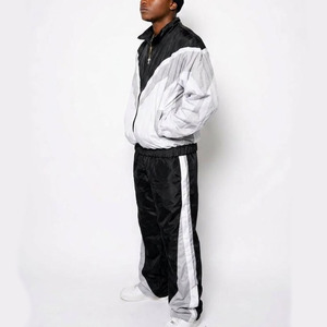 Fabricant de vêtements Streetwear : Survêtement coupe-vent personnalisé avec accent rayé géométrique contrastant, veste en nylon premium et pantalon ample - Product Image 6