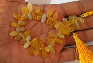 ลูกปัดหินแคลเซโดนีสีเหลืองธรรมชาติทรงข้าวเรียบ สำหรับทำเครื่องประดับ ขายส่ง - Product Image 4