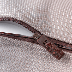 Coffee-colored double-layered cylindrical <b>laundry</b> bag with fine mesh zipper. - Product Image 3