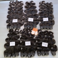 Nouvelle Arrivée Extensions de Cheveux Humains Vietnamiens 100% Bruts Non Transformés Grade 12A Tissage de Cheveux Double Trame Style Ondulé Corps Entier
