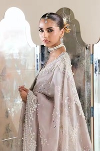 Premium Pakistani Bridle Dress Back View Of Soft Peach Pink Pastel Layered Farshi Lehnga Showcasing Heavily Embellished Long - Product Image 5