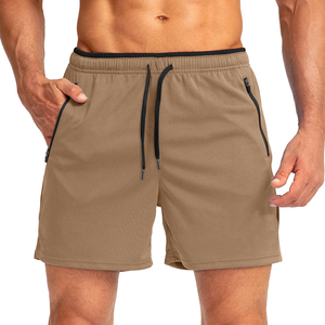 Shorts de sport bleus pour hommes à séchage rapide avec poches zippées, taille à cordon de serrage, longueur mi-cuisse, couleur unie, tissu tricoté - Product Image 2
