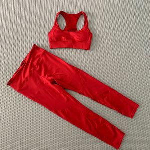 เสื้อชั้นในออกกำลังกายแบบรัดรูปสีพื้นสำหรับผู้หญิง สายรัดไหล่แบบเว้าหลัง ระบายอากาศได้ดี คอตั้ง พร้อมกางเกงโยคะเอวกลาง ชุดออกกำลังกาย 2 ชิ้น - Product Image 4